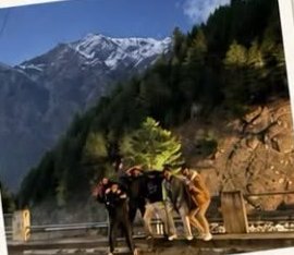 Group of friends posing by the road in Naran at golden hour
