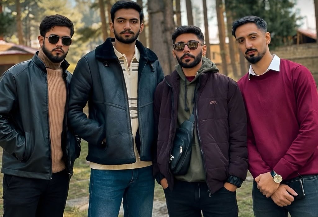 The four QuadraTravels founders standing together among pine trees